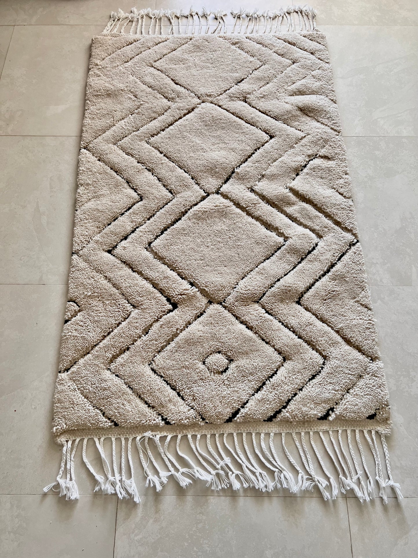 Beige Rug with Black Patterns